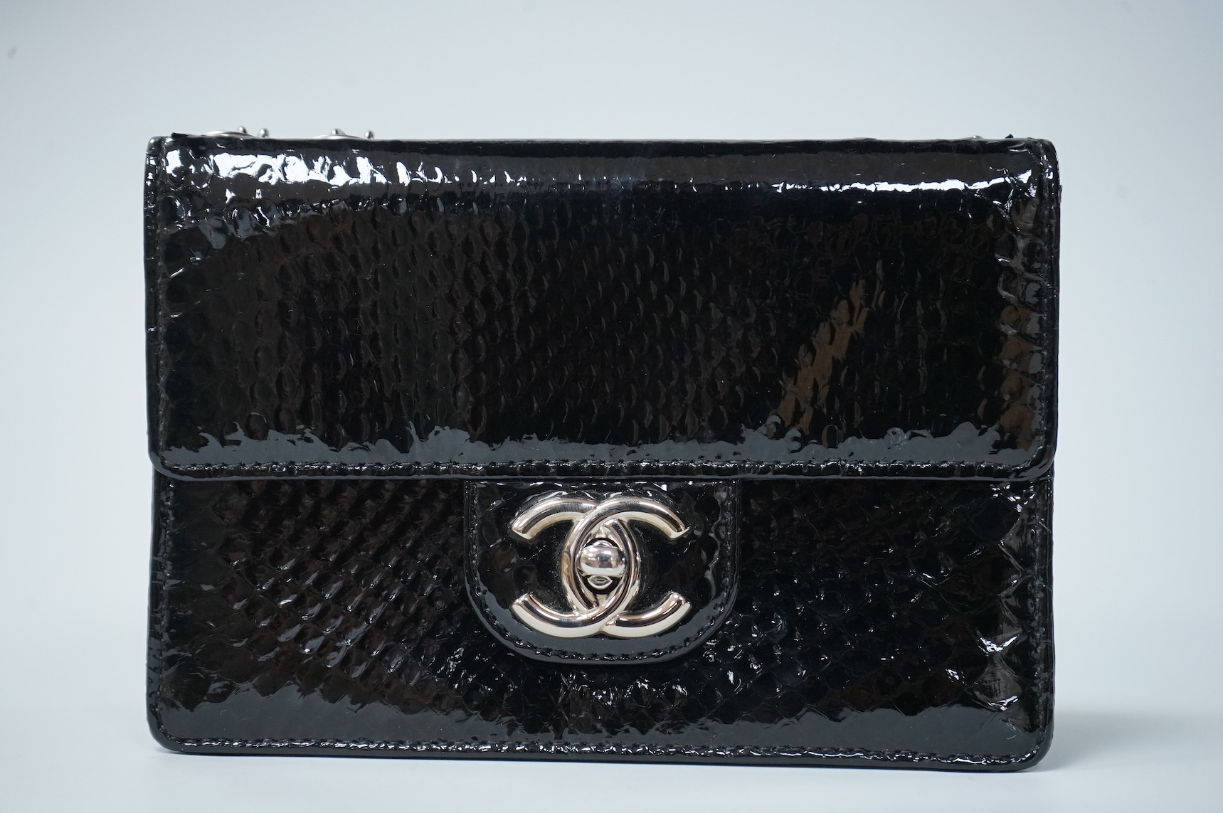 A Chanel patent black mini python handbag with silver hardware, date code 12008922, with dust bag, original paperwork, authenticity card and box, 17cm wide, Provenance: Purchased by the vendor Paris